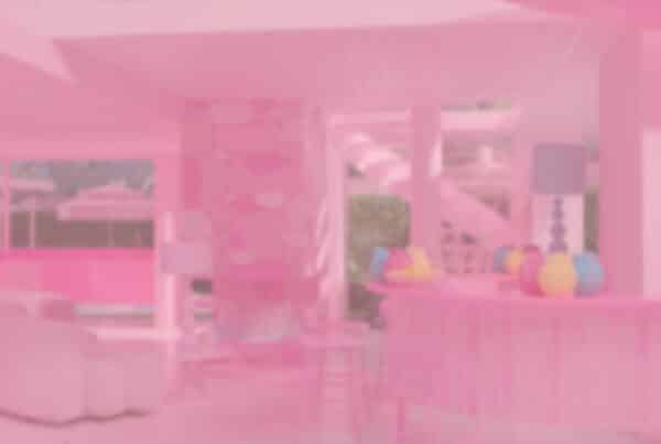 Photo of Barbie Dream House with pink gradient overlay